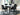 Mervannie - 5 Pc. - Counter Height Dining Table And 4 Barstools - Gray / Black