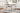 Valebeck - 5 Pc. - Counter Table With Wine Rack, 4 Swivel Stools - White / Brown